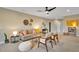 Open living area with a couch, decorative wall art, ceiling fan, and comfortable seating at 153 W Beech Slope Ct, Chapel Hill, NC 27517