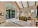 Serene main bedroom with large windows, vaulted ceilings, and hardwood floors at 153 W Beech Slope Ct, Chapel Hill, NC 27517
