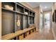 Functional mudroom with built-in storage, bench seating, and organized basket storage at 153 W Beech Slope Ct, Chapel Hill, NC 27517