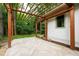 Cozy back patio featuring a pergola and herringbone-patterned brick pavers for outdoor enjoyment at 1606 Sycamore St, Durham, NC 27707
