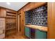 Stylish bar area with a wood countertop, wine cooler, unique wallpaper, and open shelving at 1606 Sycamore St, Durham, NC 27707
