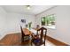 Traditional dining room featuring a wooden table, upholstered chairs, and natural light from the window at 1606 Sycamore St, Durham, NC 27707