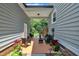 Inviting outdoor space with a covered porch and comfortable seating overlooking a green yard at 171 St. Jiles Dr, Clayton, NC 27520