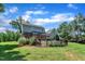 Expansive backyard features a fenced pool area, spacious deck, and lush landscaping, perfect for outdoor enjoyment and privacy at 171 St. Jiles Dr, Clayton, NC 27520