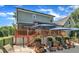 Expansive backyard features a spacious deck with an awning, pool area, and lush landscaping, perfect for outdoor activities at 171 St. Jiles Dr, Clayton, NC 27520
