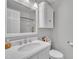 Bathroom features white vanity, toilet and shower with bright, natural light at 171 St. Jiles Dr, Clayton, NC 27520