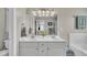 Bright bathroom featuring a double vanity with framed mirror, and a decorative plant at 171 St. Jiles Dr, Clayton, NC 27520