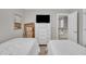 This bedroom includes two twin beds, a dresser with a television and carpet at 171 St. Jiles Dr, Clayton, NC 27520