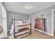 Neutral bedroom with a four-poster bed, carpet, and a dresser at 171 St. Jiles Dr, Clayton, NC 27520