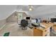Bonus room featuring neutral carpet, a ceiling fan, a desk, and bright windows for natural light at 171 St. Jiles Dr, Clayton, NC 27520