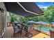 Expansive wooden deck features a dining area, grill, and overlooks a refreshing in-ground pool for outdoor enjoyment at 171 St. Jiles Dr, Clayton, NC 27520