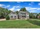 Lovely home featuring a welcoming front porch, well-manicured lawn, and mature trees, offering a serene and picturesque view at 171 St. Jiles Dr, Clayton, NC 27520