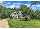 Charming home with a landscaped front yard and a welcoming front porch, perfect for enjoying the outdoors at 171 St. Jiles Dr, Clayton, NC 27520