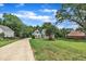 Beautifully landscaped home with a long driveway, sprawling front lawn, and mature trees, creating a private setting at 171 St. Jiles Dr, Clayton, NC 27520