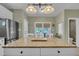Kitchen island featuring granite countertop and views to the breakfast area and patio doors at 171 St. Jiles Dr, Clayton, NC 27520