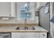 Kitchen sink with stainless appliances and a window overlooking the private back yard at 171 St. Jiles Dr, Clayton, NC 27520