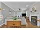 Inviting living room featuring hardwood floors, a cozy fireplace, and natural light for a relaxing and comfortable atmosphere at 171 St. Jiles Dr, Clayton, NC 27520