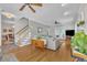 Comfortable living room with hardwood floors, a cozy sofa, and an inviting atmosphere for relaxing and entertaining guests at 171 St. Jiles Dr, Clayton, NC 27520