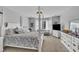 Bright main bedroom with a four-poster bed, neutral walls and carpet at 171 St. Jiles Dr, Clayton, NC 27520