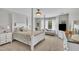 Beautiful main bedroom with four-poster bed, sitting area, and bright window at 171 St. Jiles Dr, Clayton, NC 27520