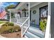 Charming porch with hanging flower baskets, white railing, and a cheerful welcome sign, creating an inviting entrance at 171 St. Jiles Dr, Clayton, NC 27520