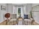 Cozy sitting area with natural light from bay window with two chairs and small table at 171 St. Jiles Dr, Clayton, NC 27520
