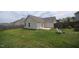 A well manicured lawn, privacy fence, and patio offer the perfect spot for outdoor relaxation at 1848 Glenn St, Burlington, NC 27217