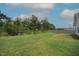 A large backyard with a lush lawn and a privacy fence is perfect for outdoor activities at 1848 Glenn St, Burlington, NC 27217