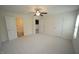 This spacious bedroom boasts plush carpeting, an ensuite bathroom, and ample closet space at 1848 Glenn St, Burlington, NC 27217