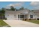 A cozy single-story home boasts an attached garage and a well-maintained lawn at 1848 Glenn St, Burlington, NC 27217