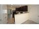 A partially-viewed kitchen area shows dark cabinets and modern appliances at 1848 Glenn St, Burlington, NC 27217