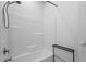 Clean bathroom with tiled shower/tub combo and minimalist design elements at 1916 Hart St, Durham, NC 27703