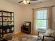 Cozy bedroom with natural light, ceiling fan, area rug, and stylish decor at 1916 Hart St, Durham, NC 27703