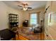 Comfortable bedroom with area rug, ceiling fan, natural light, and accent chair at 1916 Hart St, Durham, NC 27703