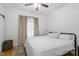 Bright bedroom with hardwood floors, ceiling fan, and soft, neutral decor at 1916 Hart St, Durham, NC 27703