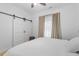 Bedroom featuring a comfortable bed, ceiling fan, and convenient closet at 1916 Hart St, Durham, NC 27703