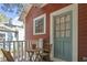 Charming front porch features a small table and chairs for relaxing at 1916 Hart St, Durham, NC 27703