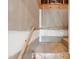 Unfinished basement staircase featuring wood railing and unfinished walls at 202 Stoneleigh Dr, Cary, NC 27511