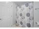 Bathroom featuring a tub with a decorative shower curtain, tile floors, and modern fixtures at 202 Stoneleigh Dr, Cary, NC 27511