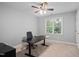 Bedroom featuring neutral walls, ceiling fan, a large desk, and natural light at 202 Stoneleigh Dr, Cary, NC 27511