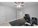 Bedroom featuring neutral walls, ceiling fan, and a large desk, perfect for a home office at 202 Stoneleigh Dr, Cary, NC 27511
