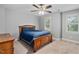 This bedroom features a ceiling fan, neutral walls, carpet floors and two windows for plenty of light at 202 Stoneleigh Dr, Cary, NC 27511