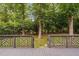 Inviting deck overlooking a private backyard with mature trees and lush landscaping at 202 Stoneleigh Dr, Cary, NC 27511