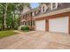 Beautiful two-story brick home with a two-car garage and a well-manicured lawn at 202 Stoneleigh Dr, Cary, NC 27511