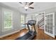 Home gym features hardwood floors, natural light and access to stairs and exterior at 202 Stoneleigh Dr, Cary, NC 27511
