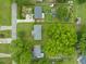 An aerial view shows residences with manicured lawns, mature trees, and gardens in a desirable neighborhood at 218 Forestville Rd, Wake Forest, NC 27587