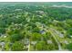 Aerial view of tree-lined residential neighborhood showcasing well-maintained homes and lush greenery at 218 Forestville Rd, Wake Forest, NC 27587