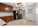 Functional kitchen with ample cabinet space, stainless steel refrigerator, and backyard access at 218 Forestville Rd, Wake Forest, NC 27587