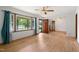 Open living room showcasing hardwood floors and a view of the front yard at 218 Forestville Rd, Wake Forest, NC 27587