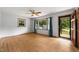 Spacious living room with hardwood floors, ceiling fan, and natural light at 218 Forestville Rd, Wake Forest, NC 27587